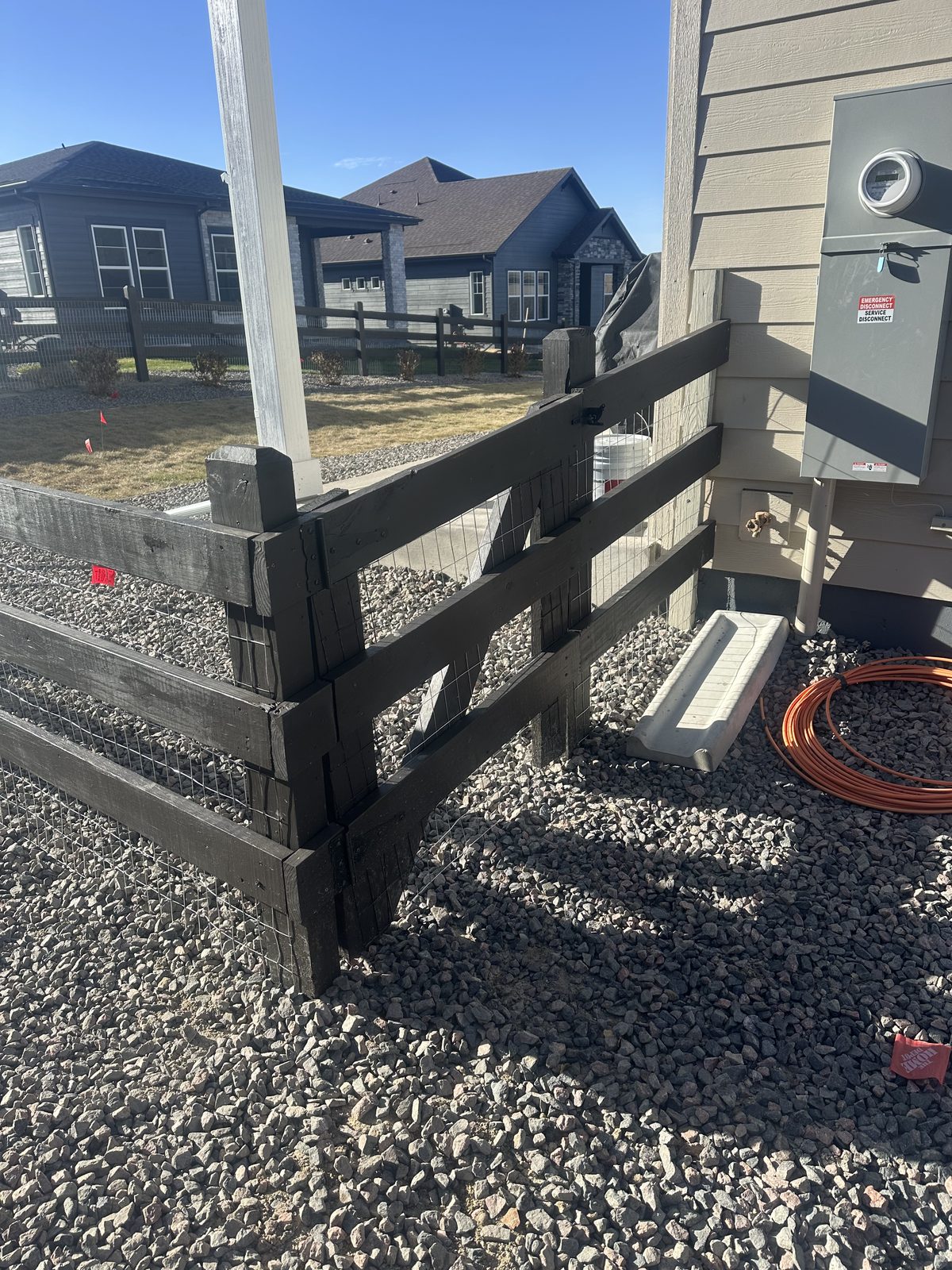 Corner post detail on a split rail and wire fence